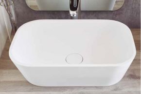 Lavabo de solid-surface sobre encimera Rust. Sanyces